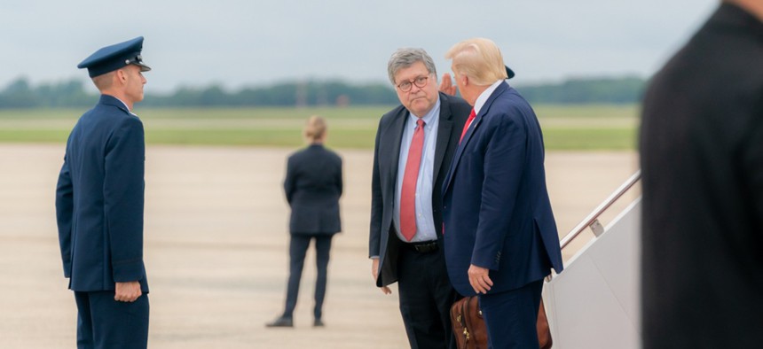 President Trump and Attorney General William Barr speak after disembarking Air Force One at Joint Base Andrews, Md., after a trip to Wisconsin on Sept. 1.