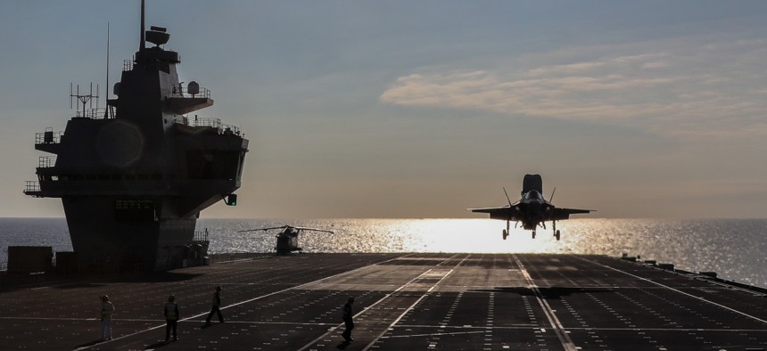 An F-35B Lightning II assigned to the F-35 Integrated Test Force at Naval Air Station Patuxent River, Md., lands aboard the Royal Navy aircraft carrier HMS Queen Elizabeth.