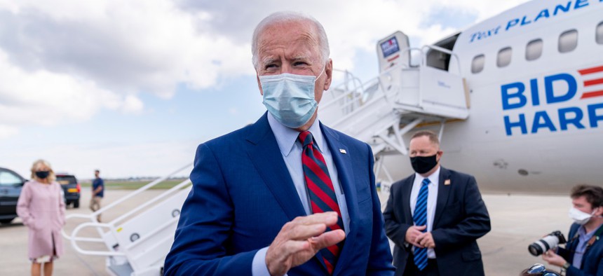 Democratic presidential candidate former Vice President Joe Biden speaks to members of the media before boarding his campaign plane at New Castle Airport in New Castle, Del., on Monday.