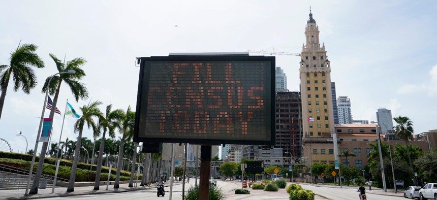 A flashing sign near the iconic "Freedom Tower," advises people to fill out their census forms on Monday, Oct. 5, in downtown Miami. 