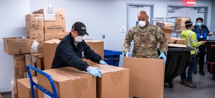 Critical N-95 respirators arrive at Bellevue Hospital where FEMA logistics and hospital personnel help unload the delivery in New York in April.