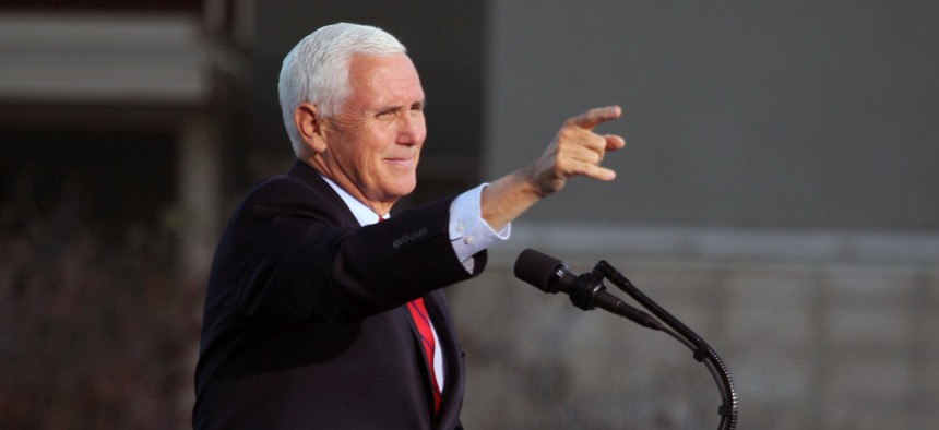 Vice President Mike Pence gestures as he speaks at a campaign rally at Reno-Tahoe International Airport in Reno, Nev., on Thursday.