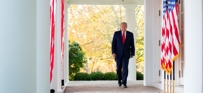 President Trump walks to a briefing in the White House Rose Garden on November 13, 2020.