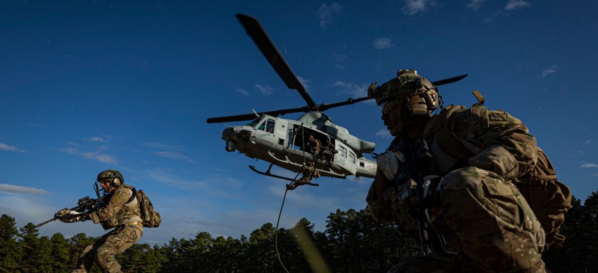 Special warfare airmen assigned to the New Jersey Air National Guard participate in fast-rope training with a Marine Corps UH-1Y Venom helicopter at Joint Base McGuire-Dix-Lakehurst, N.J., on Oct. 10, 2019.