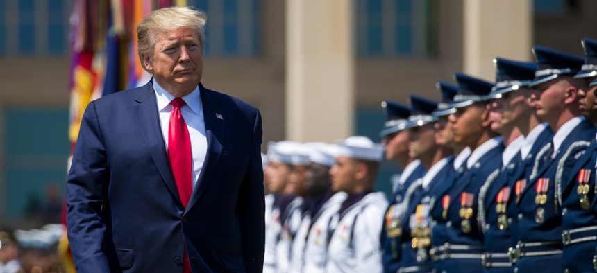 President Trump reviews the troops during a full honors welcoming ceremony for Secretary of Defense Mark Esper at the Pentagon on July 25, 2019.