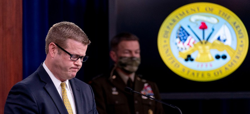 Secretary of the Army Ryan McCarthy, left, accompanied by Gen. James McConville, chief of staff of the Army, pauses while speaking about an investigation into Fort Hood, Texas, at the Pentagon on Dec. 8. 