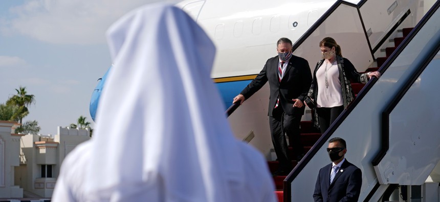 Secretary of State Mike Pompeo and his wife Susan step off a plane at Old Doha International Airport on Nov. 21, in Doha, Qatar. 