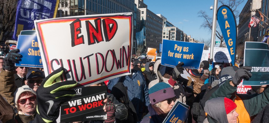 Furloughed as well as unpaid working federal employees, union members, contractors and supporters protest the government shutdown at an AFL-CIO rally Jan. 10, 2019.