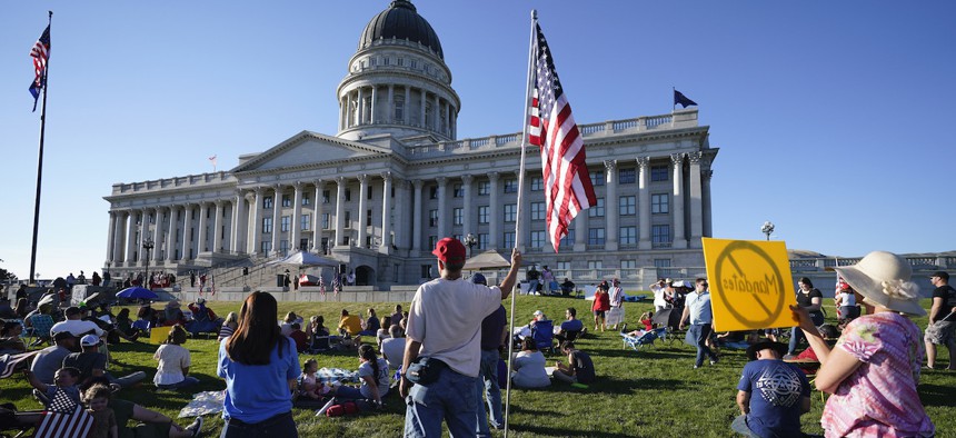 People gather during a rally during the summer against masks at the Utah capitol in Salt Lake City.