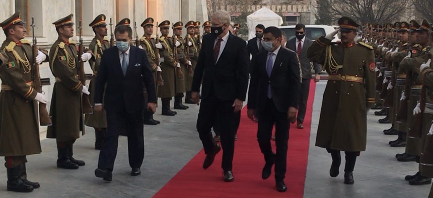 Acting Defense Secretary Christopher Miller enters the Afghanistan Presidential Palace on Tuesday.