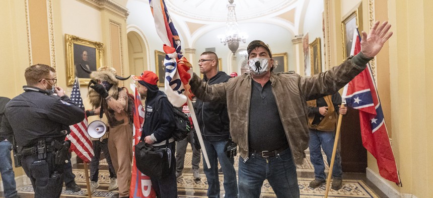 Supporters of President Donald Trump are confronted by U.S. Capitol Police officers outside the Senate Chamber on Wednesday.