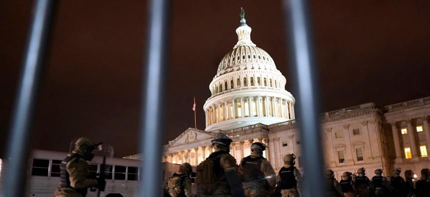 Members of the National Guard arrive to secure the area outside the U.S. Capitol, Wednesday, Jan. 6, 2021, in Washington.