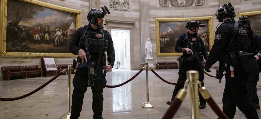 Members of the U.S. Secret Service Counter Assault Team walk through the Rotunda as they and other federal police forces responded as violent protesters loyal to President Trump stormed the U.S. Capitol on Wednesday. 