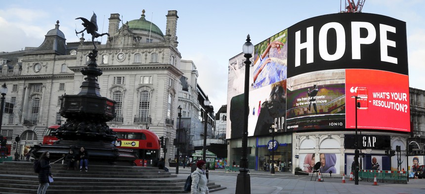An advertisement shows the word 'Hope' at an unusually quiet Piccadilly Circus, in the normally busy tourist and sightseeing area of London, Wednesday, Jan. 6.