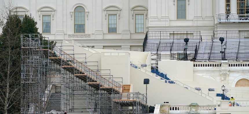 Preparations take place for President-elect Joe Biden's inauguration on the West Front of the U.S. Capitol on Jan. 8. The temporary senior executive hiring freeze will last until the inauguration on Jan. 20. 