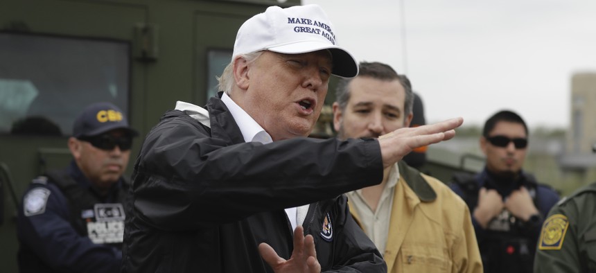President Donald Trump speaks as tours the U.S. border with Mexico at the Rio Grande on the southern border, Thursday, Jan. 10, 2019, in McAllen, Texas, as Sen. Ted Cruz, R-Texas, listens