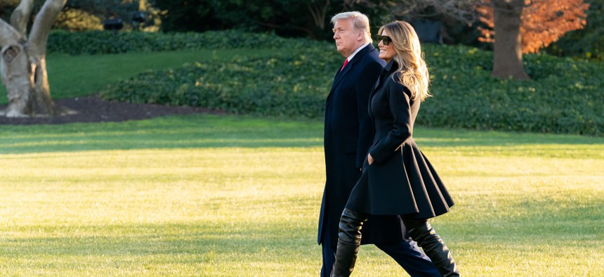 President Donald J. Trump and First Lady Melania Trump walk across the South Lawn of the White House Wednesday, Dec. 23, 2020, before boarding Marine One to begin their trip to Florida.