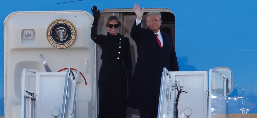 President Trump and first lady Melania Trump wave to a crowd as they board Air Force One at Andrews Air Force Base, Md., on Wednesday morning. 