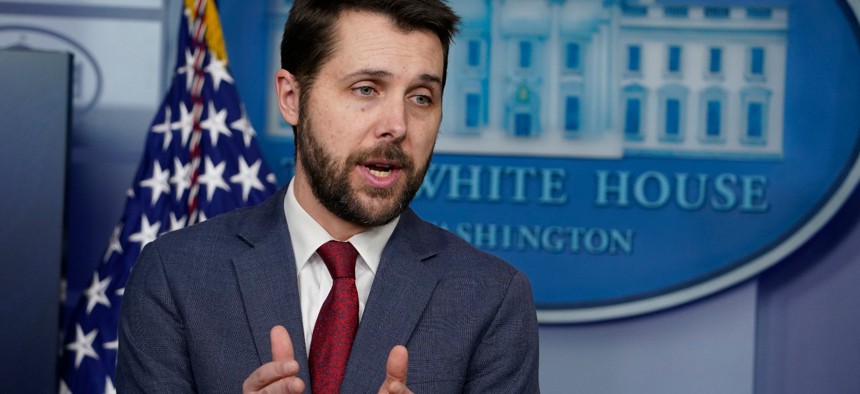 National Economic Council Director Brian Deese speaks during a press briefing at the White House on Friday. Deese said federal contractors "should be provided the benefits and pay that workers deserve."