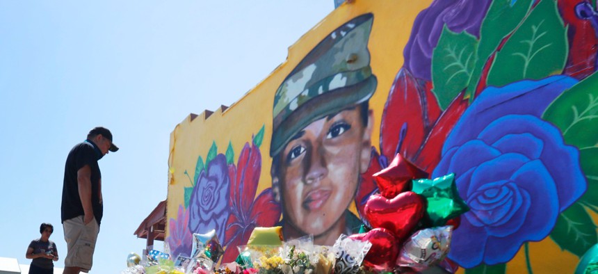 People look at a mural of slain Army Spc. Vanessa Guillen painted on a wall on the south side of Fort Worth, Texas, on July 11.
