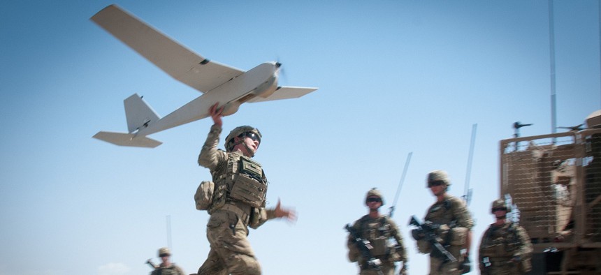 U.S. Army Chief Warrant Officer 2 Dylan Ferguson, a brigade aviation element officer with the 82nd Airborne Division's 1st Brigade Combat Team, launches a Puma unmanned aerial vehicle on June 25, 2012, in Ghazni Province, Afghanistan. 