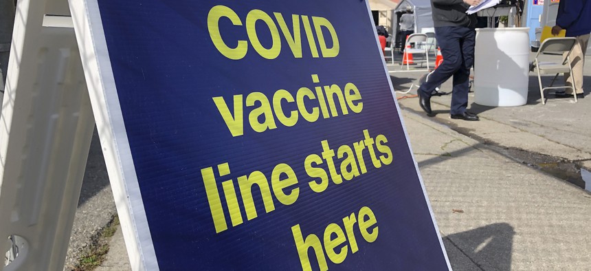 A sign is shown at a COVID-19 vaccine site in the Bayview neighborhood of San Francisco on Feb. 8.