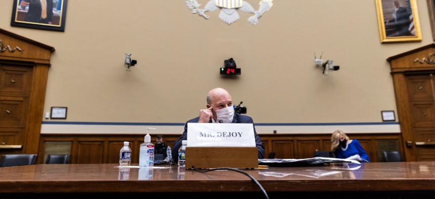 Postmaster General Louis DeJoy speaks during a House Oversight and Reform Committee hearing on Feb. 24. 