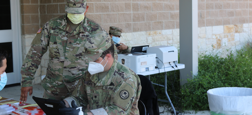 Airmen and Soldiers with the Texas National Guard perform COVID-19 testing as part of the Texas Mobile Testing Team program in Bryan, Texas.