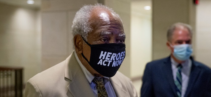 Rep. Danny Davis, D-Ill., center, arrives for a press conference on Capitol Hill over the summer. Davis is one of the lawmakers calling for changes at SSA. 