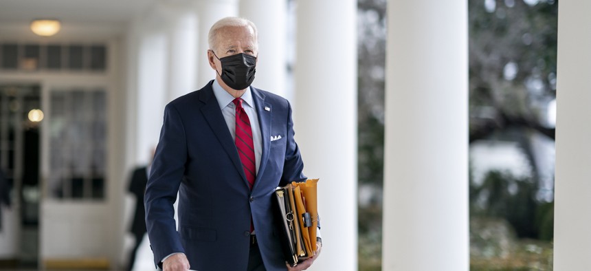 President Joe Biden walks along the Colonnade of the White House in January.