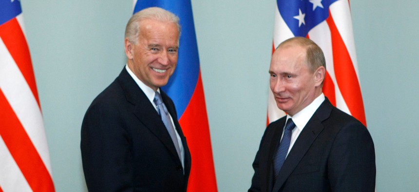 Then-Vice President Biden, left, shakes hands with Russian Prime Minister Vladimir Putin in Moscow, Russia, in March 2011. 