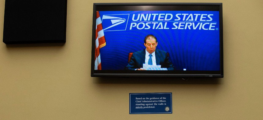 Chairman of the United States Postal Service Board of Governors Ron Bloom speaks via video conference during a February congressional hearing. Bloom is a Democrat but lawmakers are upset he has not done more to stand up to Postmaster General Louis DeJoy. 