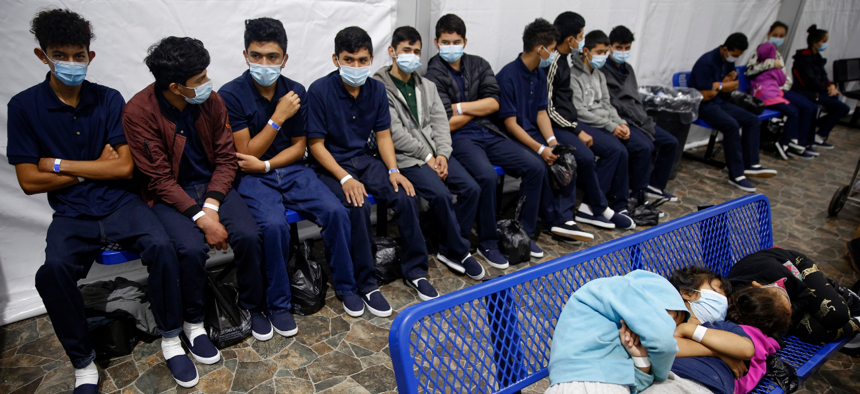 Young unaccompanied migrants wait for their turn at the secondary processing station inside the U.S. Customs and Border Protection facility in Texas on Tuesday, March 30, 2021.