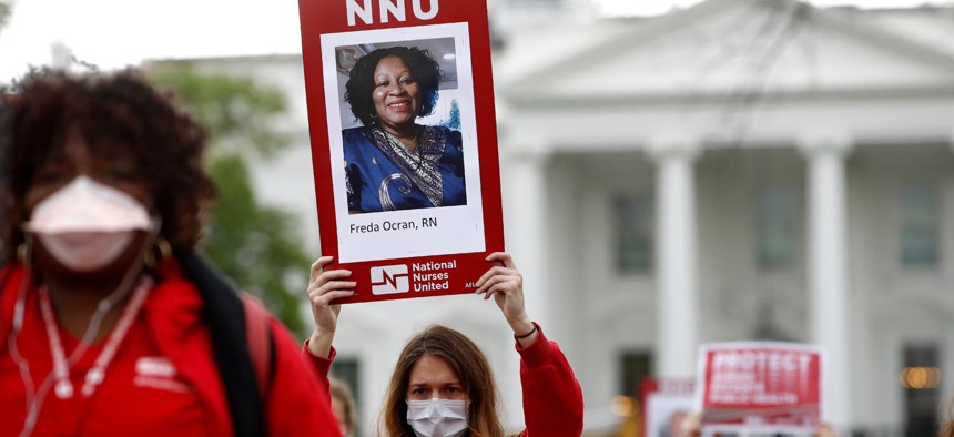Nurses from National Nurses United protest in front of the White House on,April 21, 2020.