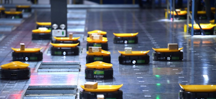 Robots work at a warehouse in China's Anhui province.