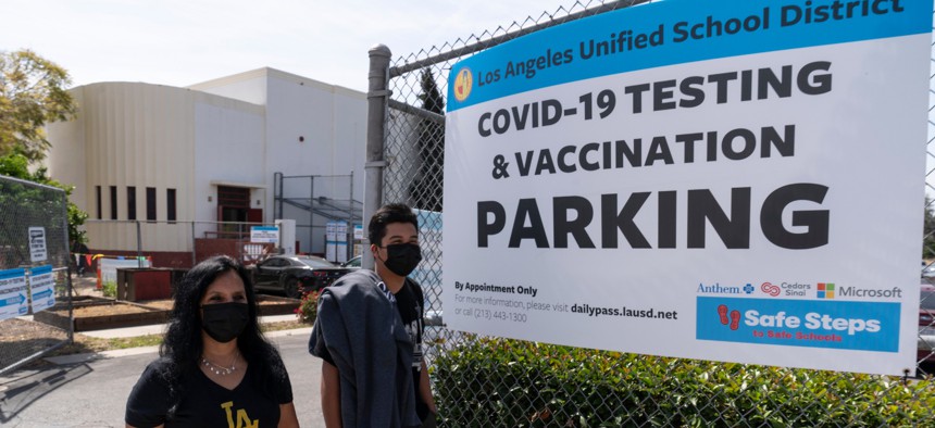 Rosa Vargas and her son, 9th grade student Victor Loredo, 14, walk home after getting tested at a Los Angeles Unified School District COVID-19 testing and vaccination site in East Los Angeles on April 15.