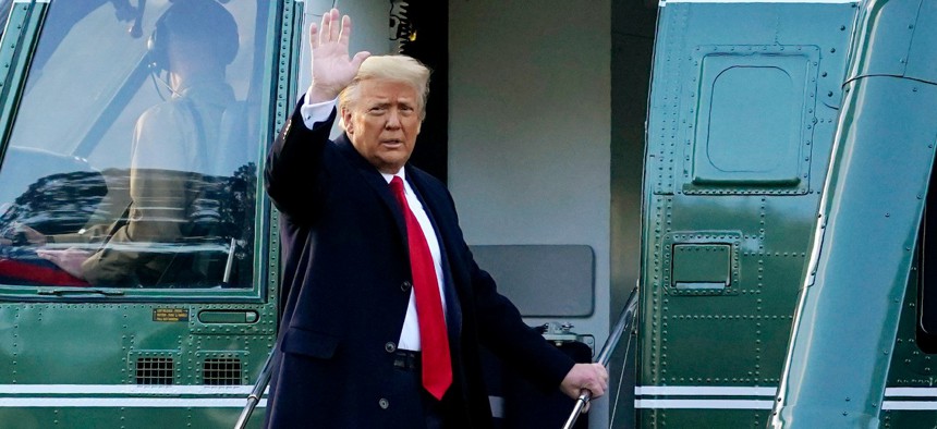 President Trump waves as he boards Marine One on the South Lawn of the White House on Jan. 20, 2021. 