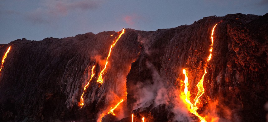 Lava from Kilauea volcano entering ocean, Big Island, Hawaii.