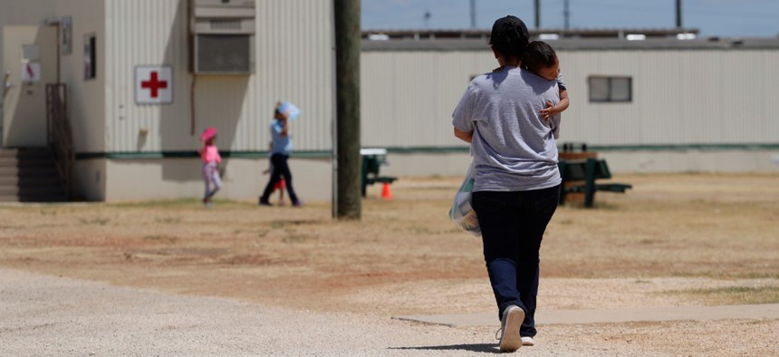 Immigrants seeking asylum walk at the ICE South Texas Family Residential Center in August 2019. 