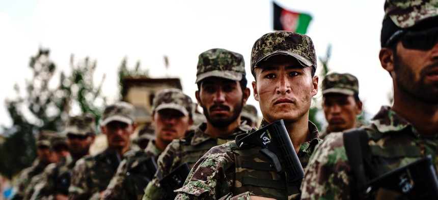 Afghan National Army Special Operations Commandos stand in formation during a visit by Chief of General Staff of the Armed Forces Gen. Mohammad Yasin Zia and his command staff, in Camp Commando, Afghanistan, Wednesday, April 28, 2021.