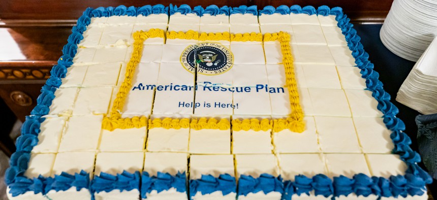 A cake is cut and ready to serve in the West Wing Lobby of the White House on Friday, March 12, 2021, to celebrate the signing of the American Rescue Plan.