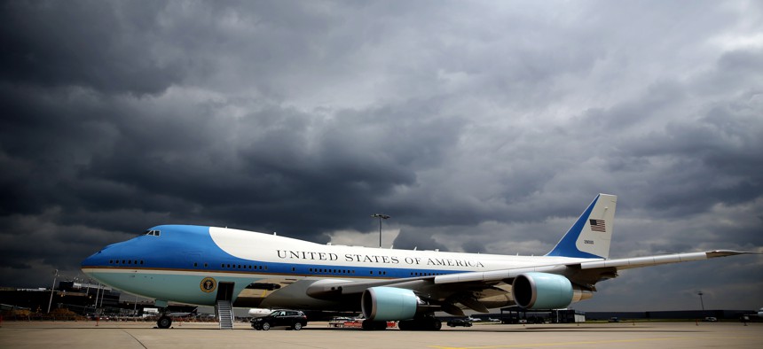 Dark clouds are seen behind the Air Force One on the tarmac at the airport Langenhagen near Hanover, central Germany, on April 25, 2016.
