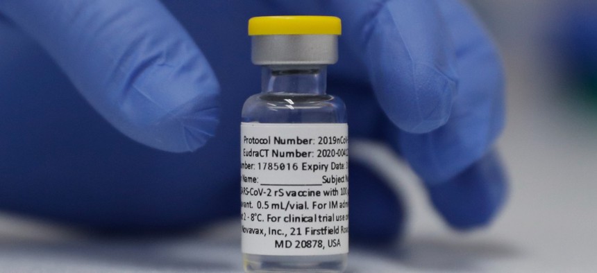 A vial of the Phase 3 Novavax coronavirus vaccine is seen ready for use in the trial at St. George's University hospital in London in October 2020. 