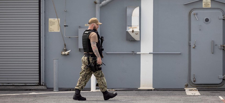 A member of the US Navy walks at the US navy's ship "Hershel Woody Williams" during the "African Lion" military exercise, on June 11, 2021, in Morocco's city of Agadir.
