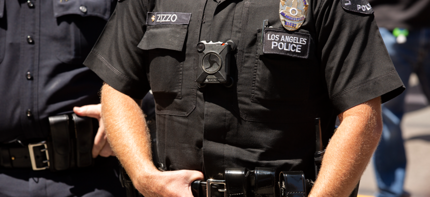 Soon all Justice Department law enforcement officers will wear body cameras, as many local police departments require. Above, a member of the Los Angeles Police Department.