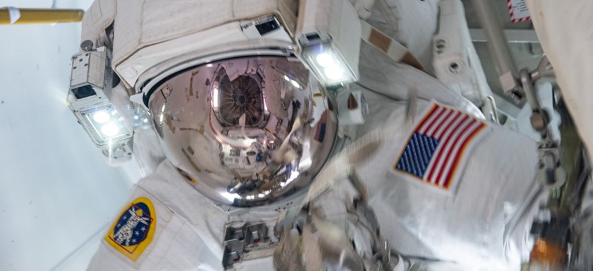 NASA spacewalker Shane Kimbrough is pictured in the U.S. Quest airlock after he and fellow spacewalker Thomas Pesquet of the European Space Agency completed the installation of the second roll out solar array on the International Space Station's Port-6 truss structure.