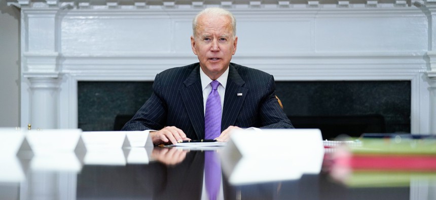 President Biden speaks during a meeting at the White House in June. 