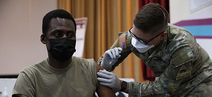 U.S. Army Maj. Bielosa Aworh, assigned to the 24th Theater Public Affairs Support Element, receives the COVID-19 vaccination at Stayton Theater, at Fort Bliss, Texas, in February. 