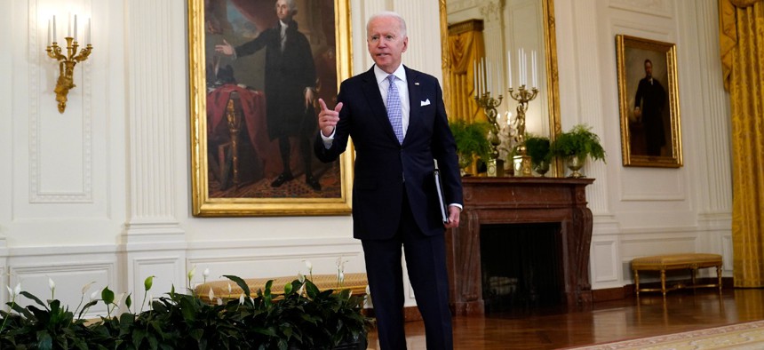 President Biden answers a question from a reporter after he spoke about COVID-19 vaccine requirements for federal workers Thursday. 