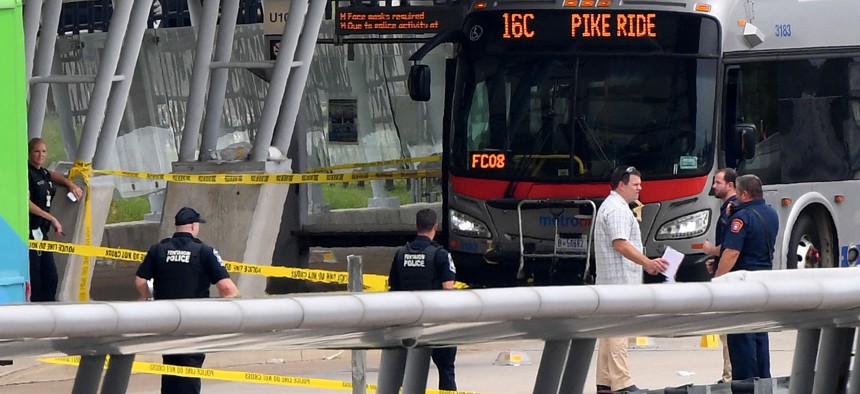 Law enforcement officers are seen at the metro bus platform outside the Pentagon after a shooting and lockdown August 3, 2021. 